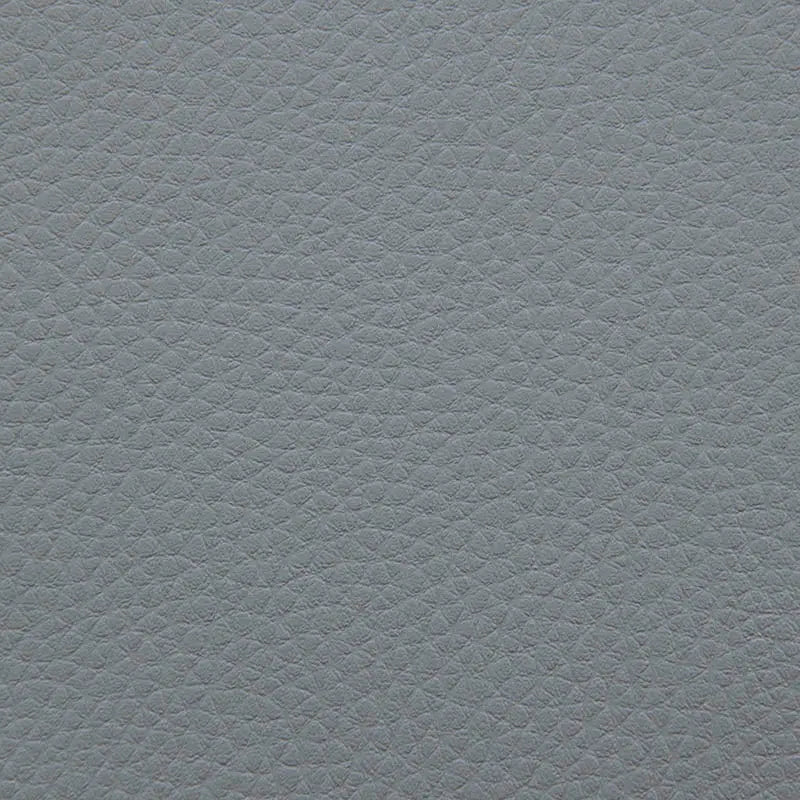 Närbild på grå sittsäck fåtölj i Lounge 100-modell med texturerat tyg.