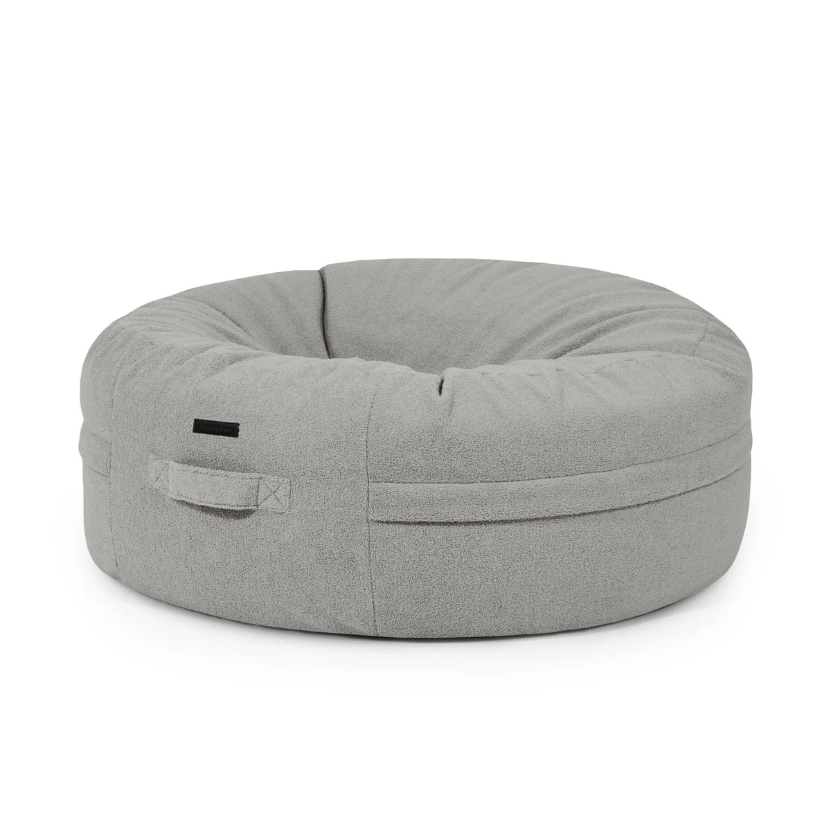 saccosäck Teddy White Grey - donut-formad saccosäck i mjukt grått tyg för avkoppling och gemenskap.