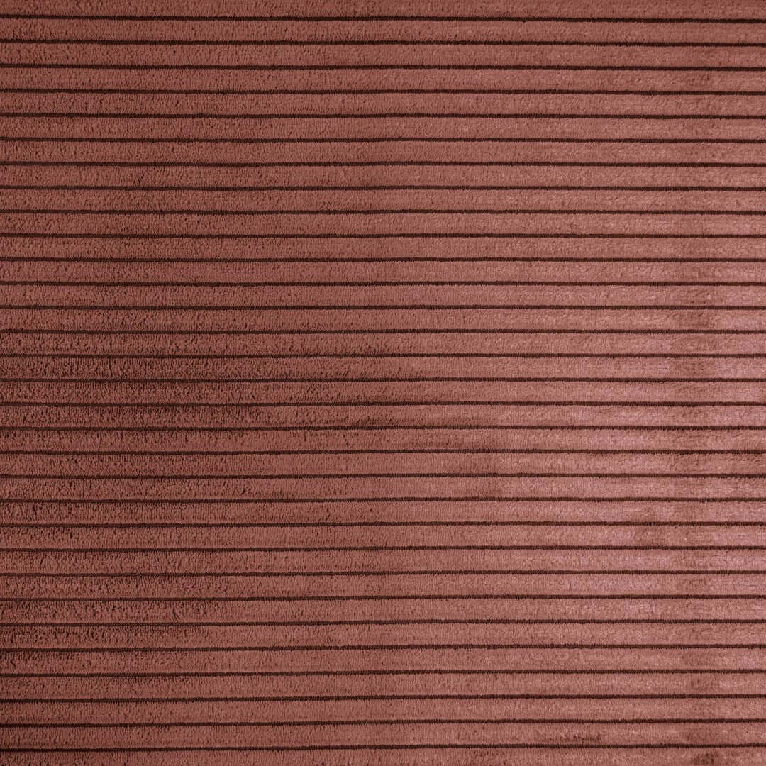Närbild på korallfärgad ribbad tygtextur för Lounge 100 sittsäcksfåtölj.
