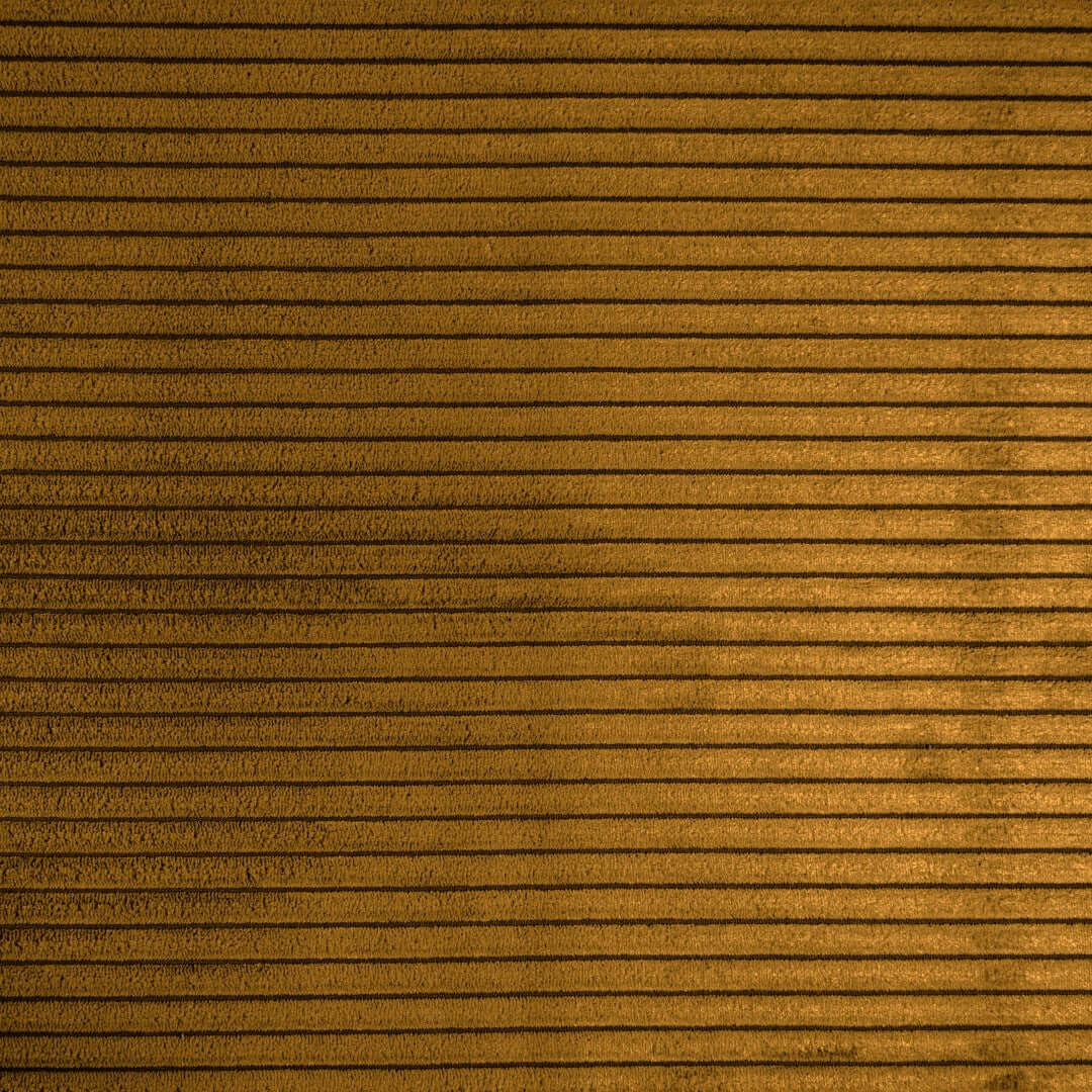 Texturerad senapsgul sittsäcksfåtölj med vågigt ribbat mönster.
